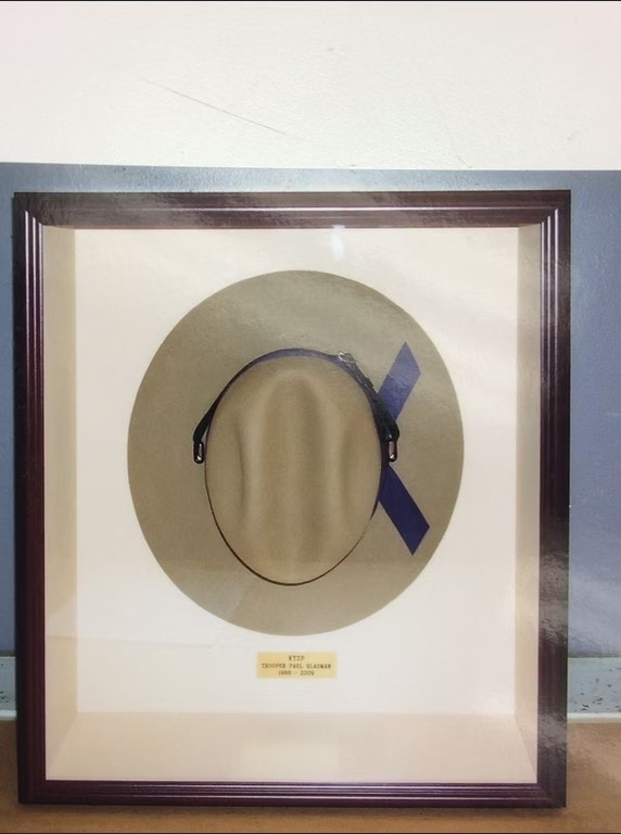 Framed trooper hat memorial shadow box for Trooper Paul Blauman 1956–2008